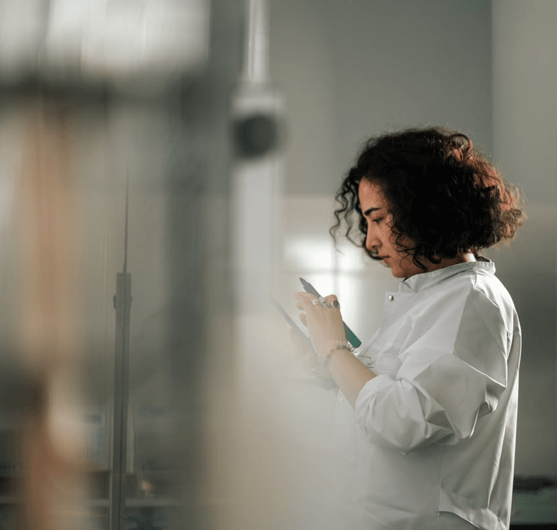 Laboratory specialist recording information during a co-development process.